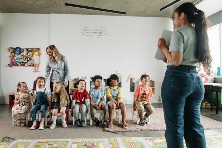 Early childhood education degree students observing a preschool classroom